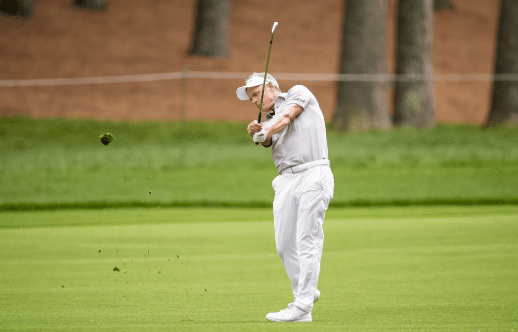 May 16, 2025; Charlotte, North Carolina, USA; Luke Donald hits his second shot on the second hole during the second round of the PGA Championship golf tournament at Quail Hollow. Mandatory Credit: Jim Dedmon-Imagn Images