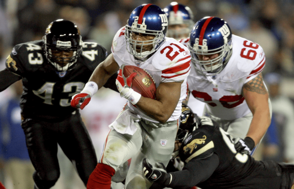 New York Giants running back (21) Tiki Barber runs during the 3rd quarter against the Jacksonville Jaguars at Alltel Stadium in Jacksonville, Florida. Jaguars defeated the Giants 26-10.