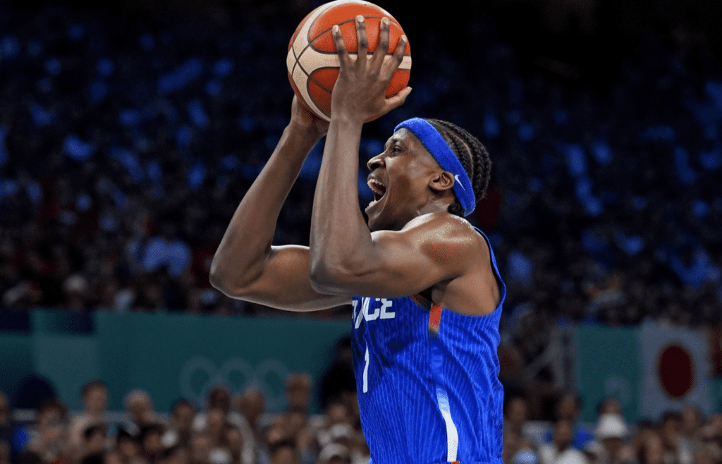 France point guard Frank Ntilikina (1) shoots the ball against Japan point guard Yuki Togashi (2) in men’s basketball group B play during the Paris 2024 Olympic Summer Games at Stade Pierre-Mauroy.
