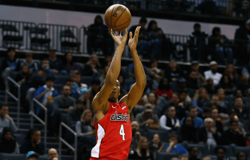 Washington Wizards forward Wesley Johnson (4) shoots the ball against the Charlotte Hornets in the first half at Spectrum Center.