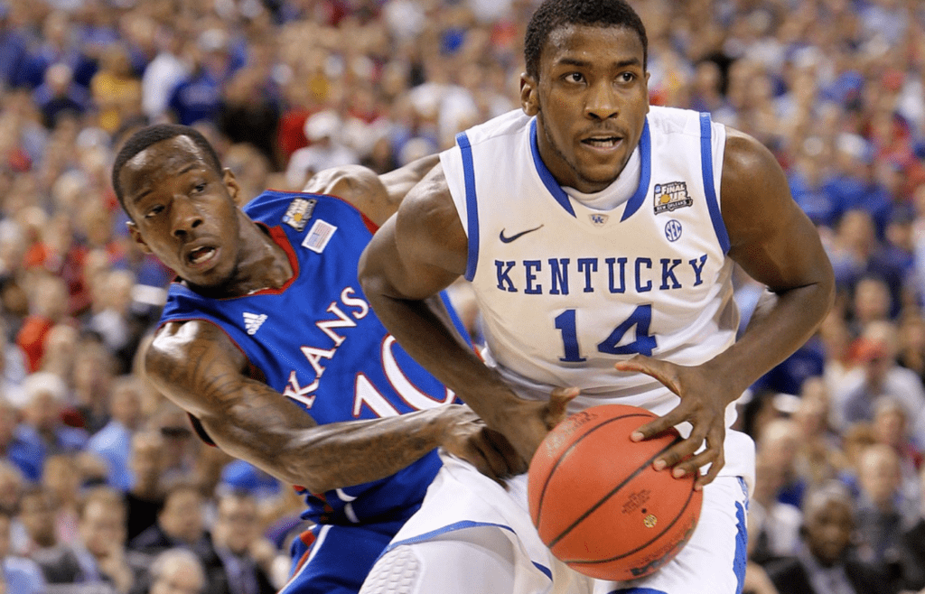 Michael Kidd-Gilchrist battles with Tyshawn Taylor in the first half
