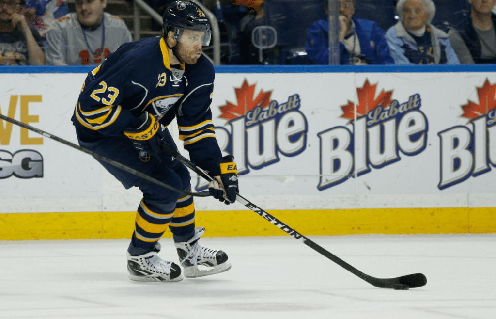 Apr 13, 2014; Buffalo, NY, USA; Buffalo Sabres left wing Ville Leino (23) skates with the puck against the New York Islanders at First Niagara Center. Islanders beat Buffalo 4 to 3 in a shootout. Mandatory Credit: Timothy T. Ludwig-Imagn Images