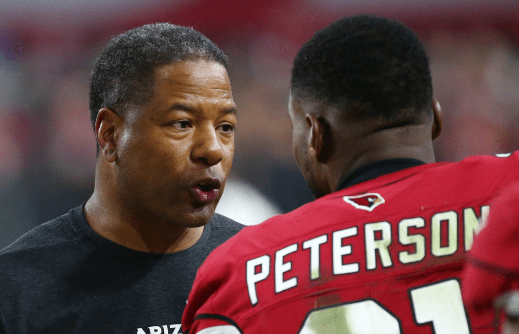 Arizona Cardinals head coach Steve Wilks talks to Patrick Peterson against the Seattle Seahawks in the second half at State Farm Stadium in Glendale, Ariz.