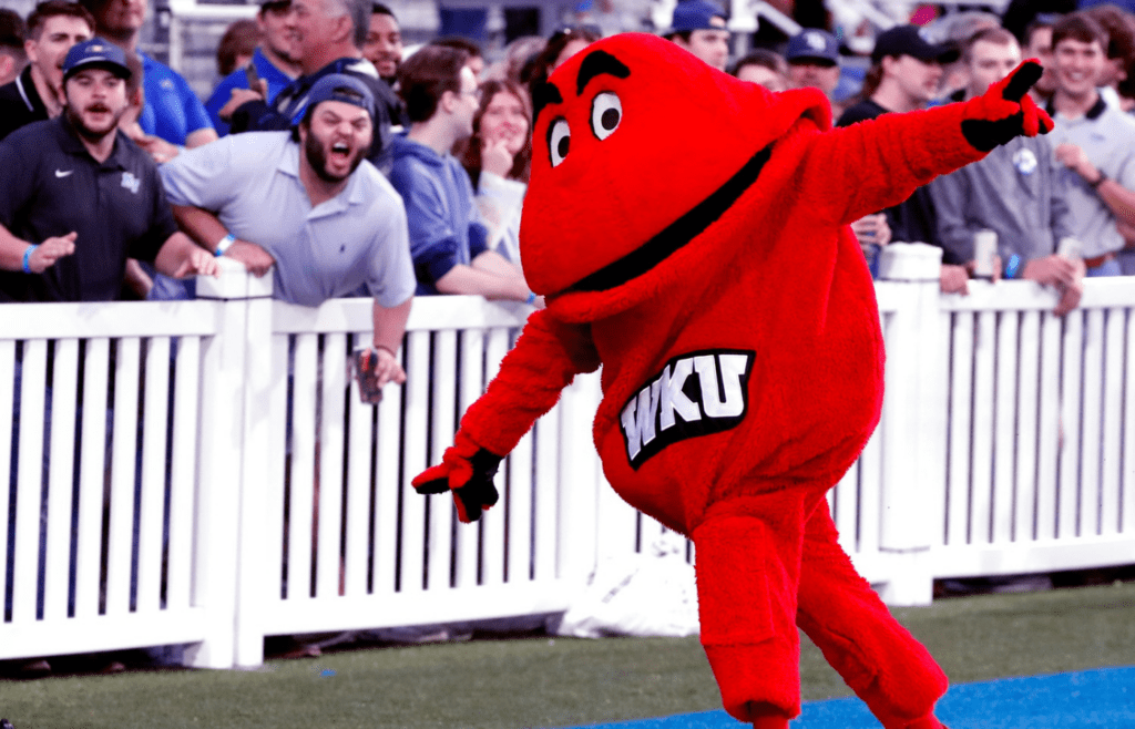 Western Kentucky’s mascot Big Red celebrates a touchdown against Middle Tennessee as Middle Tennessee fans react in the background during the rivalry football game at MTSU, on Saturday, Sept. 14, 2024
