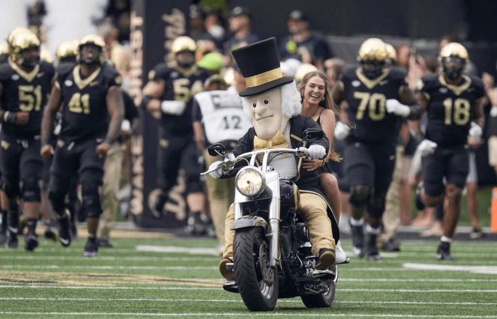 Sep 28, 2024; Winston-Salem, North Carolina, USA; Wake Forest Demon Deacons mascot leads the team onto the field during the first half against the Louisiana-Lafayette Ragin Cajuns at Allegacy Federal Credit Union Stadium. Mandatory Credit: Jim Dedmon-Imagn Images