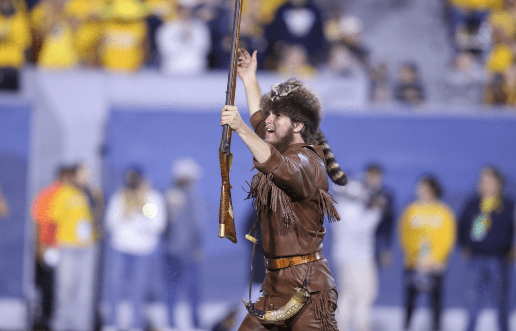 Sep 7, 2024; Morgantown, West Virginia, USA; The West Virginia Mountaineers mascot cheers during the fourth quarter against the Albany Great Danes at Mountaineer Field at Milan Puskar Stadium. Mandatory Credit: Ben Queen-Imagn Images
