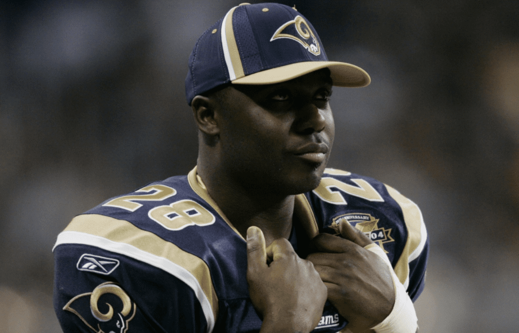 Dec 5, 2004; St. Louis, MO, USA; Running back Marshall Faulk #28 of the St. Louis Rams watches his team play the San Francisco 49ers at the Edward Jones Dome. Faulk did not play due to an knee injury. The Rams beat the 49ers 16-6. Mandatory Credit: Photo by Dilip Vishwanat-Imagn Images (©) Copyright 2004 by Dilip Vishwanat