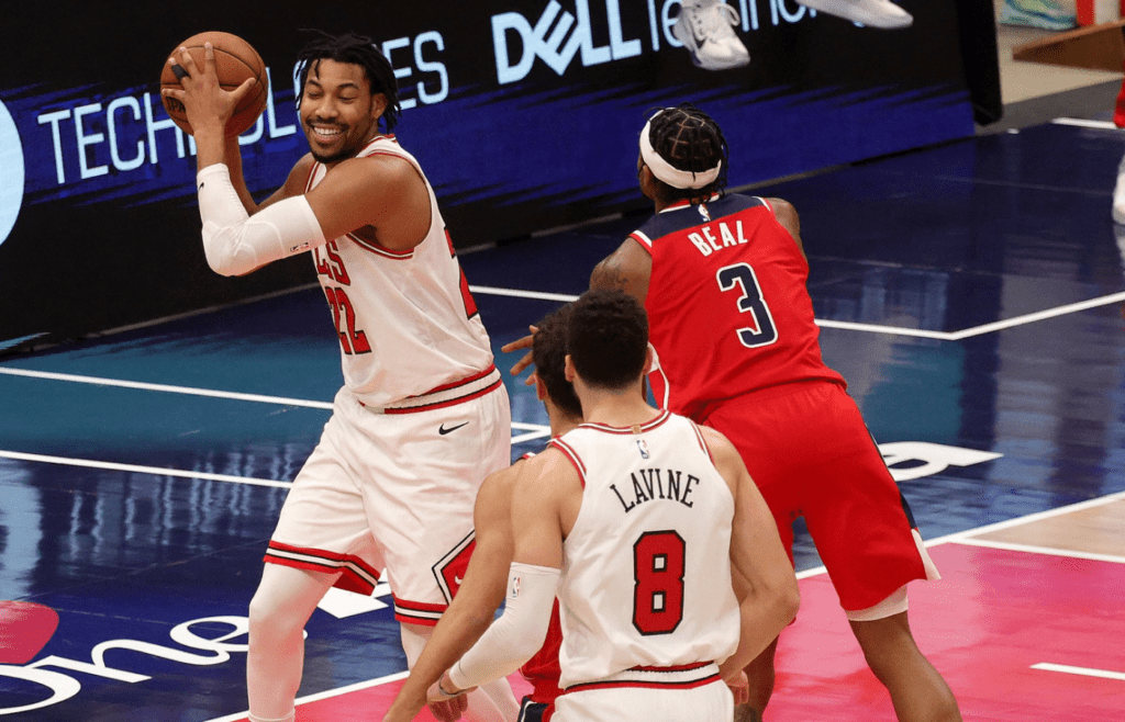 Dec 31, 2020; Washington, DC, USA; Bradley Beal #3 of the Washington Wizards fouls Otto Porter Jr. #22 of the Chicago Bulls during the closing seconds of the Bulls 133-130 win at Capital One Arena. Mandatory Credit: Rob Carr/Pool Photo-Imagn Images