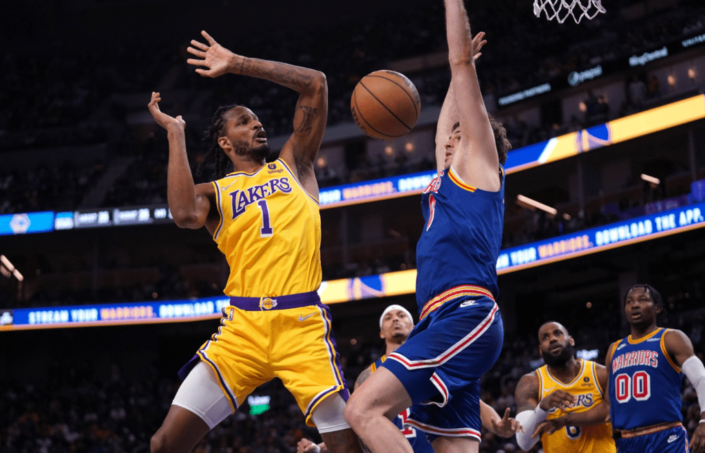 Feb 12, 2022; San Francisco, California, USA; Los Angeles Lakers forward Trevor Ariza (1) loses control of the ball next to Golden State Warriors forward Nemanja Bjelica (8) in the fourth quarter at the Chase Center. Mandatory Credit: Cary Edmondson-Imagn Images