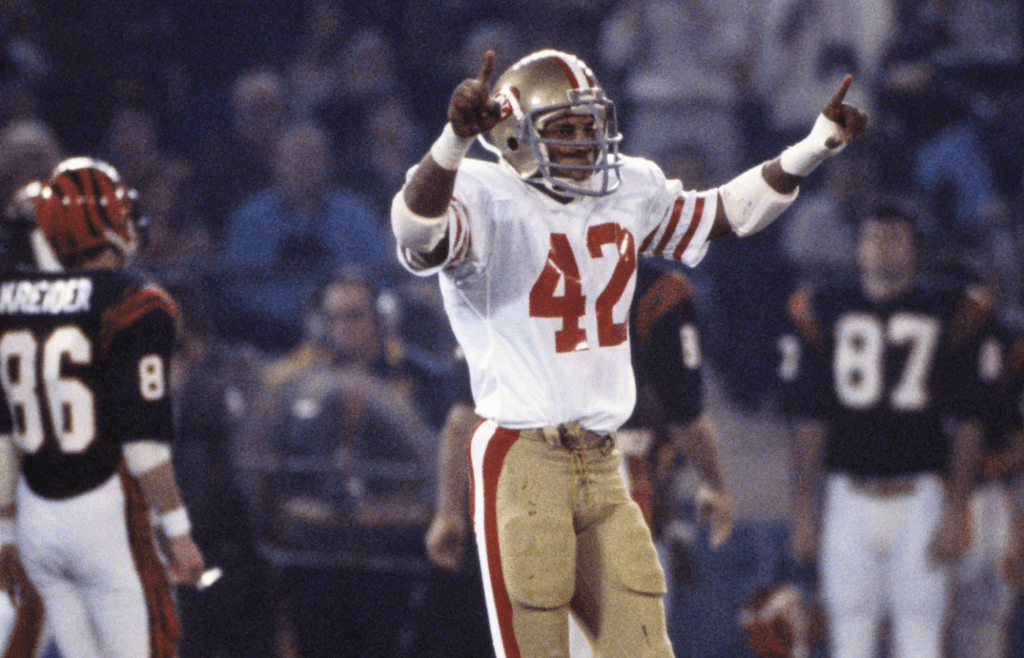 Jan 24, 1982; Detroit, MI, USA; FILE PHOTO; San Francisco 49ers defensive back Ronnie Lott (42) celebrates against the Cincinnati Bengals during Super Bowl XVI at the Silverdome. The 49ers defeated the Bengals 26-21. Mandatory Credit: Manny Rubio-Imagn Images
