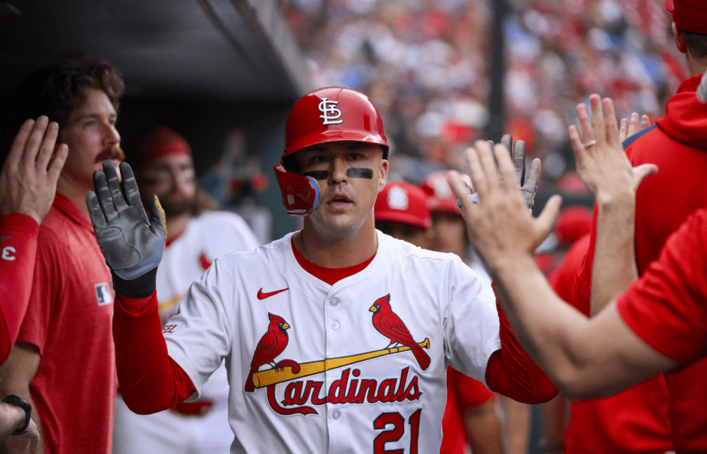 Jun 5, 2025; St. Louis, Missouri, USA; St. Louis Cardinals left fielder Lars Nootbaar (21) is congratulated by teammates after scoring against the Kansas City Royals during the first inning at Busch Stadium. Mandatory Credit: Jeff Curry-Imagn Images