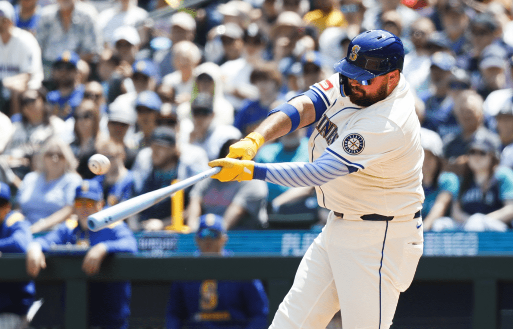 Jun 15, 2025; Seattle, Washington, USA; Seattle Mariners first baseman Rowdy Tellez (23) hits a double against the Cleveland Guardians during the second inning at T-Mobile Park. Mandatory Credit: Joe Nicholson-Imagn Images