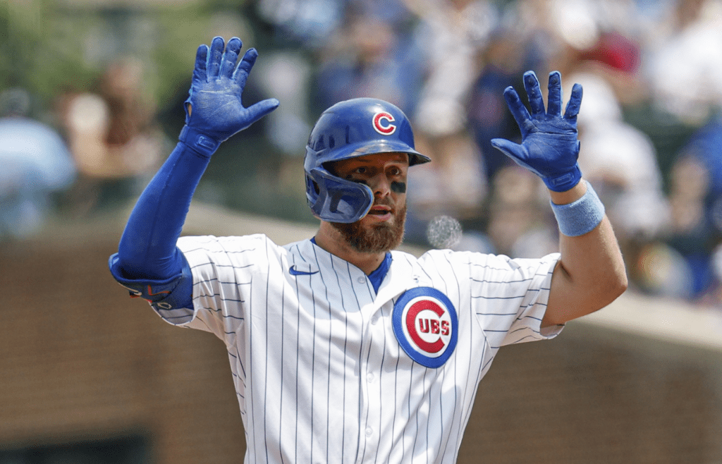 Jun 15, 2025; Chicago, Illinois, USA; Chicago Cubs first baseman Michael Busch (29) celebrates after hitting a double against the Pittsburgh Pirates during the first inning at Wrigley Field. Mandatory Credit: Kamil Krzaczynski-Imagn Images
