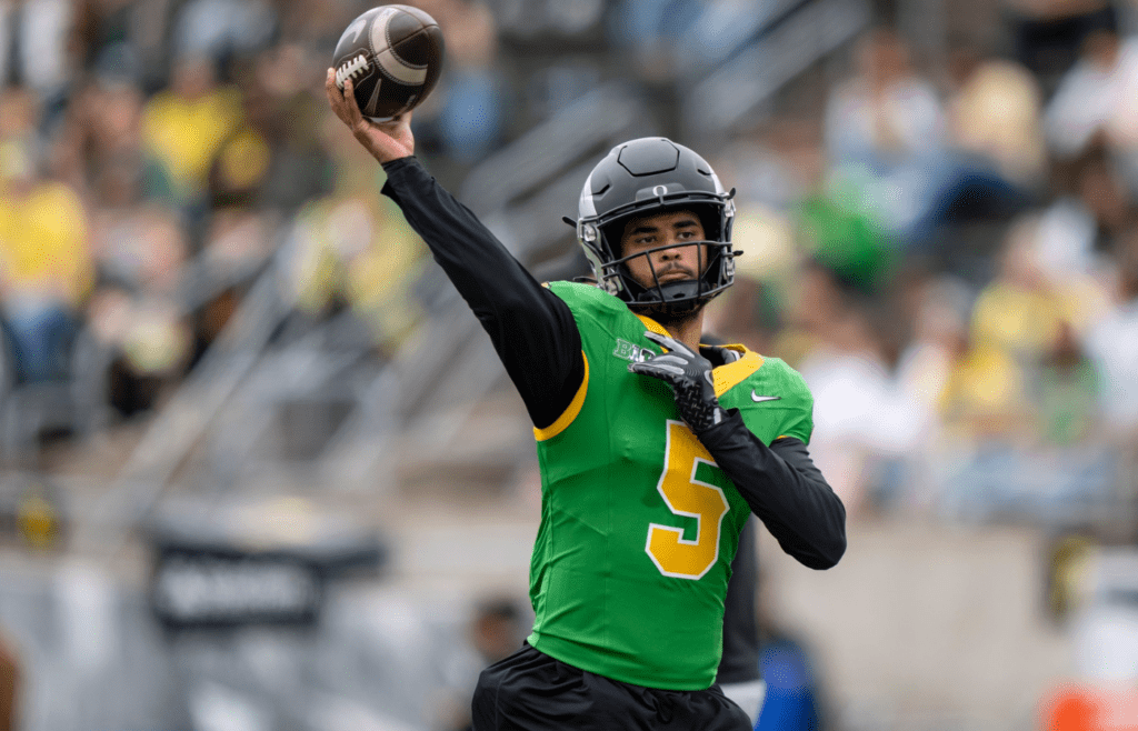 Combat Ducks quarterback Dante Moore throws out a pass as the Fighting Ducks face off against Mighty Oregon in the Oregon Ducks spring game on April 26, 2025, at Autzen Stadium in Eugene.