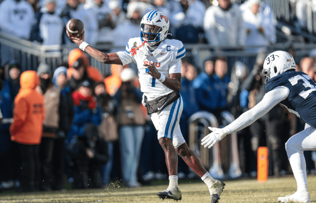 Dec 21, 2024; University Park, Pennsylvania, USA; Southern Methodist Mustangs quarterback Kevin Jennings (7) throws the ball during the first half against the Penn State Nittany Lions at Beaver Stadium. Mandatory Credit: Vincent Carchietta-Imagn Images