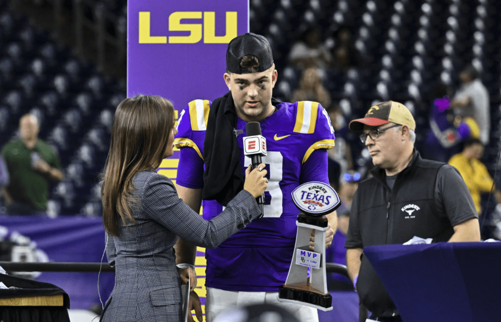 Dec 31, 2024; Houston, TX, USA; LSU Tigers quarterback Garrett Nussmeier (13) speaks after receiving the MVP trophy after the game against the Baylor Bears at NRG Stadium. The Tigers defeat the Bears 44-31. Mandatory Credit: Maria Lysaker-Imagn Images