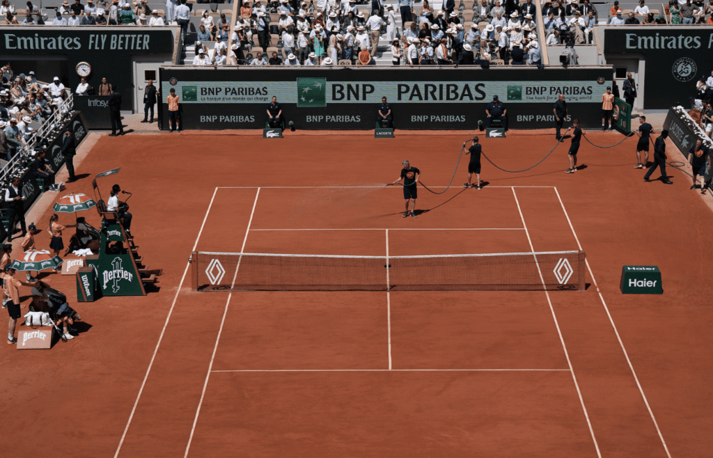 Jun 7, 2024; Paris, France; General view of watering the court for the Carlos Alcaraz of Spain and Jannik Sinner of Italy match on day 13 of Roland Garros at Stade Roland Garros. Mandatory Credit: Susan Mullane-Imagn Images