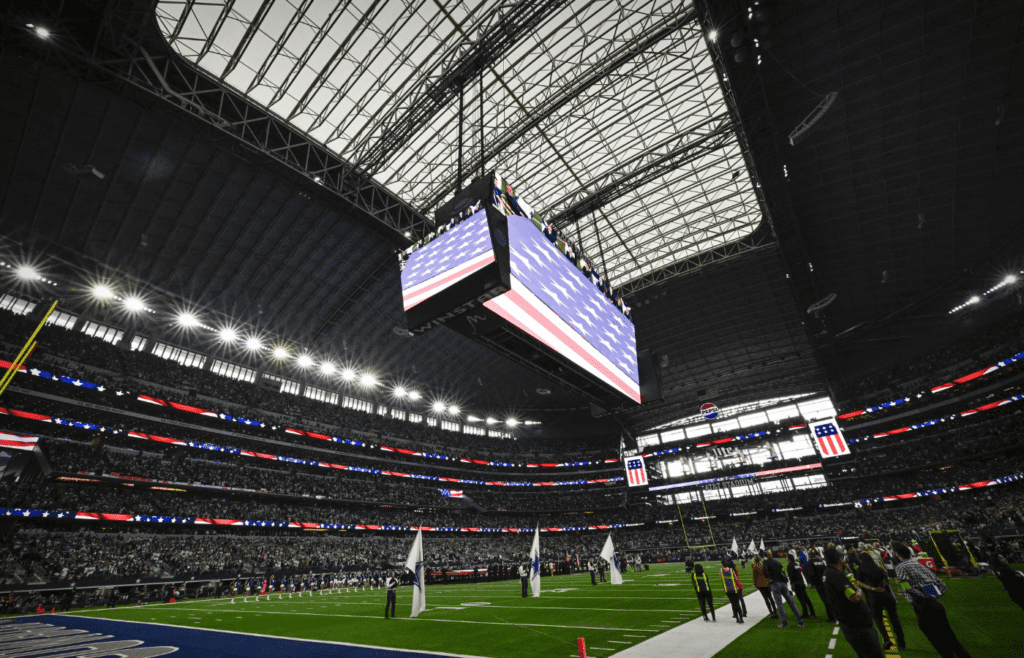 Nov 23, 2023; Arlington, Texas, USA; A view the US flag and the stadium during the playing of the national anthem before the game between the Dallas Cowboys and the Washington Commanders at AT&T Stadium. Mandatory Credit: Jerome Miron-Imagn Images