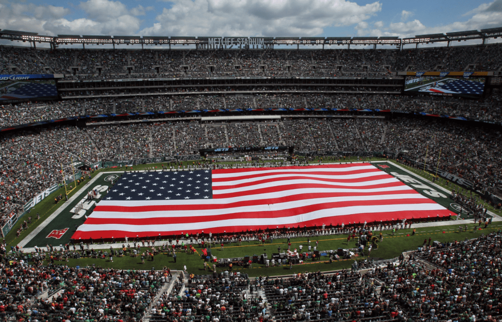 Sep 8, 2013; East Rutherford, NJ, USA; General view of a giant flag on the field during the national anthem before a game between the New York Jets and the Tampa Bay Buccaneers at MetLife Stadium. Mandatory Credit: Brad Penner-Imagn Images