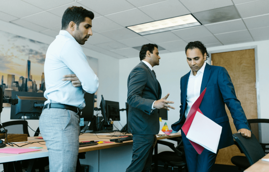 Awkward pause after subtle disagreement in office