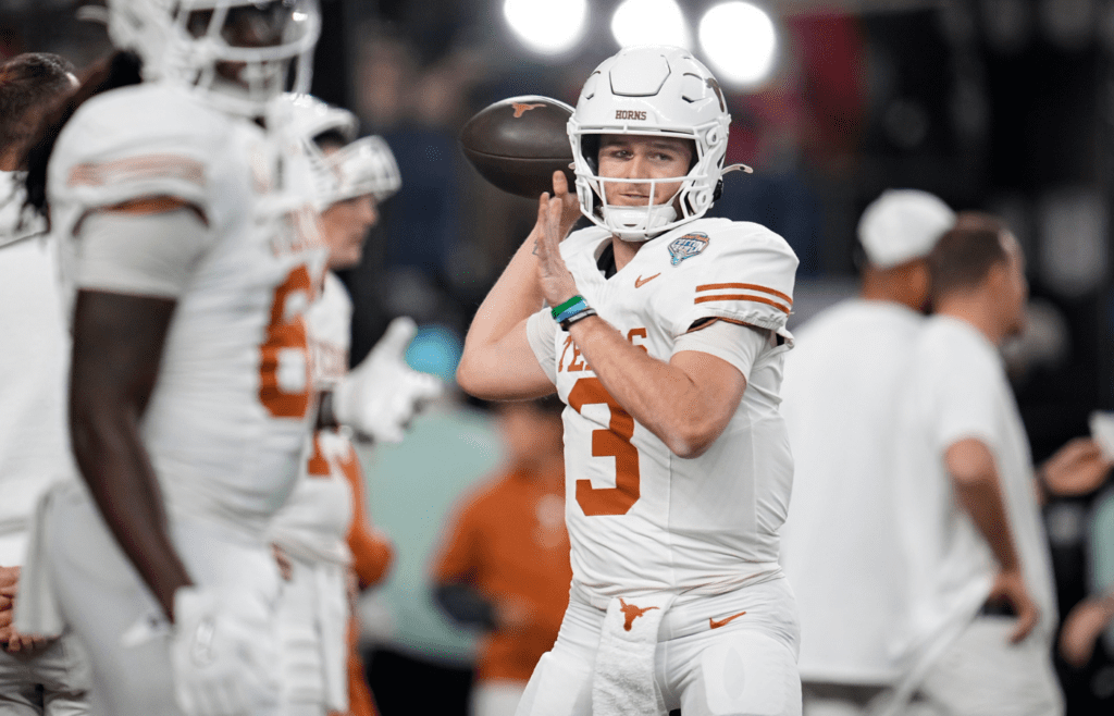 Texas Longhorns quarterback Quinn Ewers (3) warms up prior to the Cotton Bowl Classic College Football Playoff semifinal game between the Ohio State Buckeyes and the Texas Longhorns at AT&T Stadium in Arlington, Texas on Jan. 10, 2025.