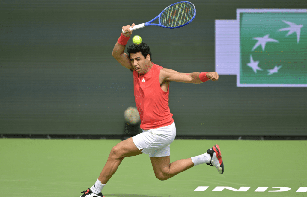 Mar 5, 2025; Indian Wells, CA, USA; Jaume Munar (ESP) hits a shot against Kei Nishikori (not pictured) in his first round match during the BNP Paribas Open at the Indian Well Tennis Garden. Mandatory Credit: Jayne Kamin-Oncea-Imagn Images