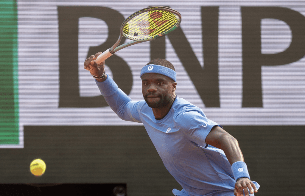 Jun 3, 2025; Paris, FR; Frances Tiafoe of the United States returns a shot during his match against Lorenzo Musetti of Italy on day 10 at Roland Garros Stadium. Mandatory Credit: Susan Mullane-Imagn Images