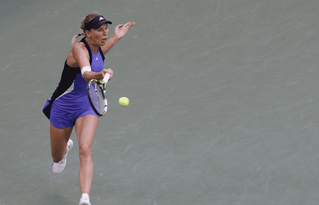 Sep 2, 2024; Flushing, NY, USA; Caroline Wozniacki (DEN) hits a forehand against Beatriz Haddad Maia (BRA)(not pictured) in a women's singles match on day eight of the 2024 U.S. Open tennis tournament at USTA Billie Jean King National Tennis Center. Mandatory Credit: Geoff Burke-Imagn Images