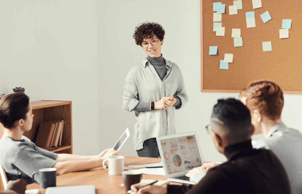 Frustrated employee pretending interest in meeting discussion