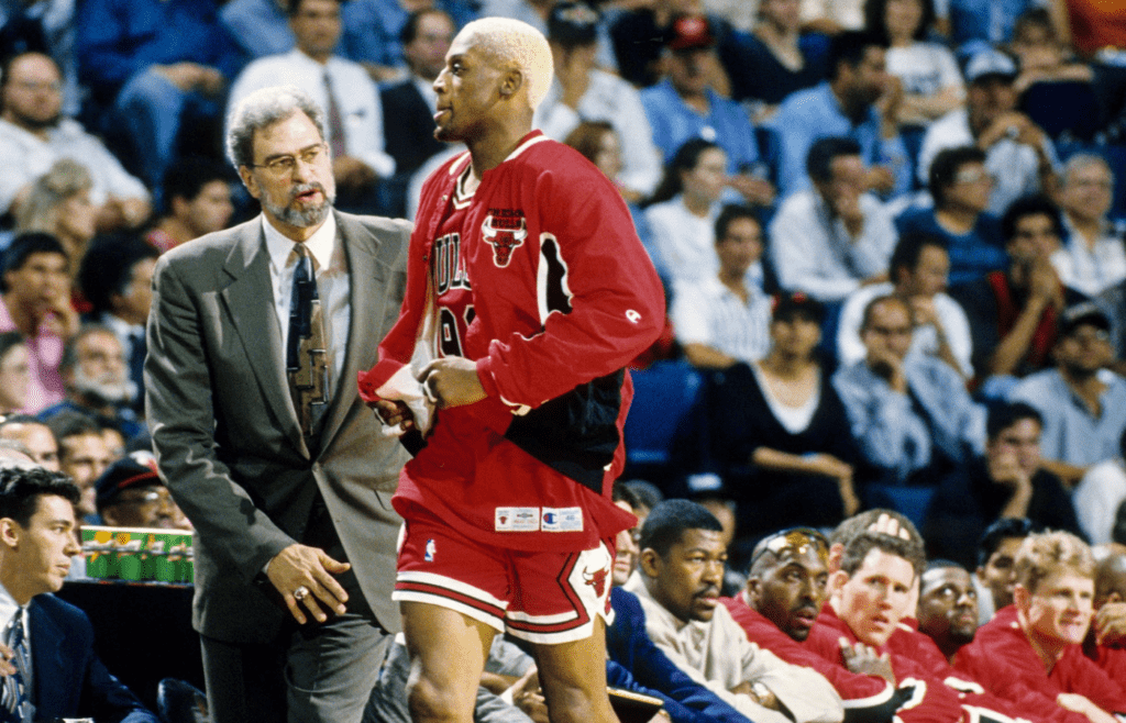 May 1, 1996; Miami, FL; USA; FILE PHOTO; Chicago Bulls head coach Phil Jackson and forward Dennis Rodman talk on the sidelines against the Miami Heat during the first round of the 1996 NBA Playoffs at the Miami Arena. Mandatory Credit: RVR Photos-Imagn Images