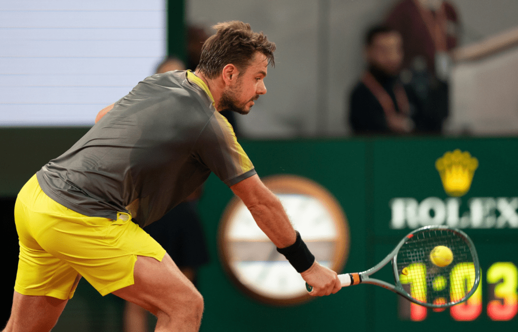 May 26, 2024; Paris, France; Stan Wawrinka of Switzerland returns a shot during his match against Andy Murray of Great Britain on day one of Roland Garros at Stade Roland Garros. Mandatory Credit: Susan Mullane-Imagn Images