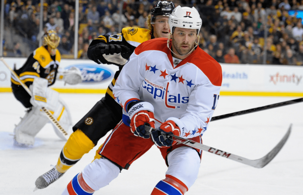 Mar 6, 2014; Boston, MA, USA; Washington Capitals right wing Dustin Penner chase the puck in the corner during the first period against the Boston Bruins at TD Banknorth Garden. Mandatory Credit: Bob DeChiara-Imagn Images