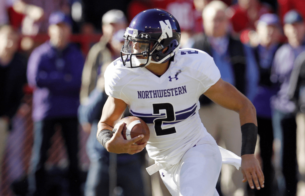 Nov 2, 2013; Lincoln, NE, USA; Northwestern Wildcats quarterback Kain Colter (2) runs against the Nebraska Cornhuskers at Memorial Stadium. Mandatory Credit: Bruce Thorson-Imagn Images