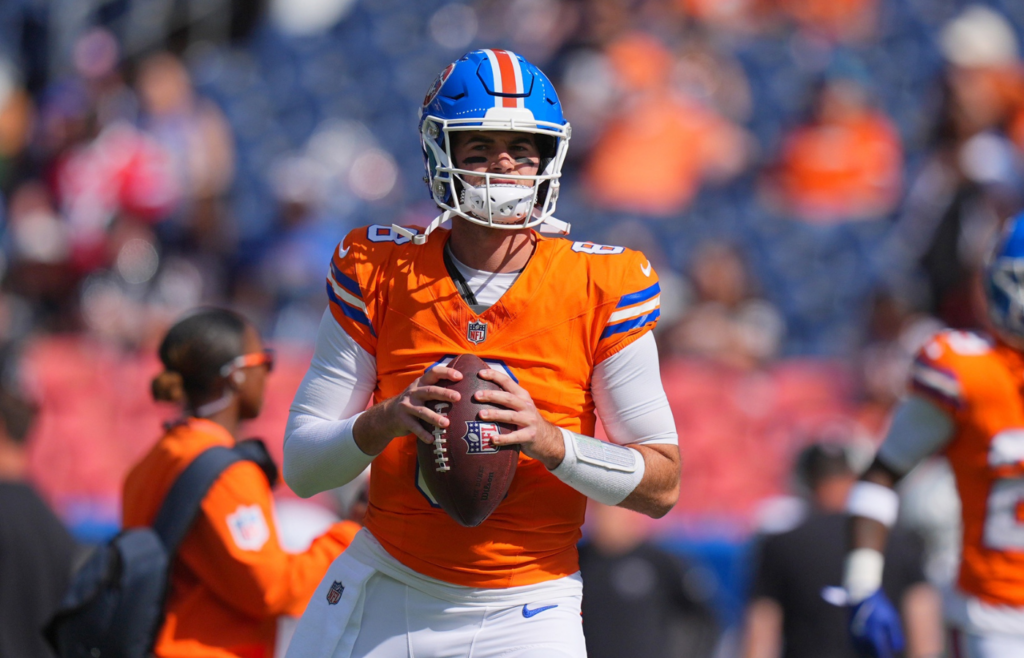 Oct 6, 2024; Denver, Colorado, USA; Denver Broncos quarterback Jarrett Stidham (8) warms up before the game against the Las Vegas Raiders at Empower Field at Mile High. Mandatory Credit: Ron Chenoy-Imagn Images