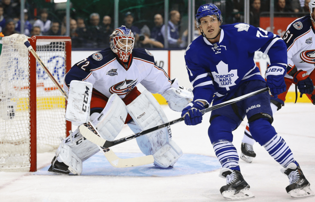 Jan 9, 2015; Toronto, Ontario, CAN; Toronto Maple Leafs right wing David Clarkson (71) goes to the net as Columbus Blue Jackets goalie Sergei Bobrovsky (72) guards the net at Air Canada Centre. The Maple Leafs beat the Blue Jackets 5-2. Mandatory Credit: Tom Szczerbowski-Imagn Images