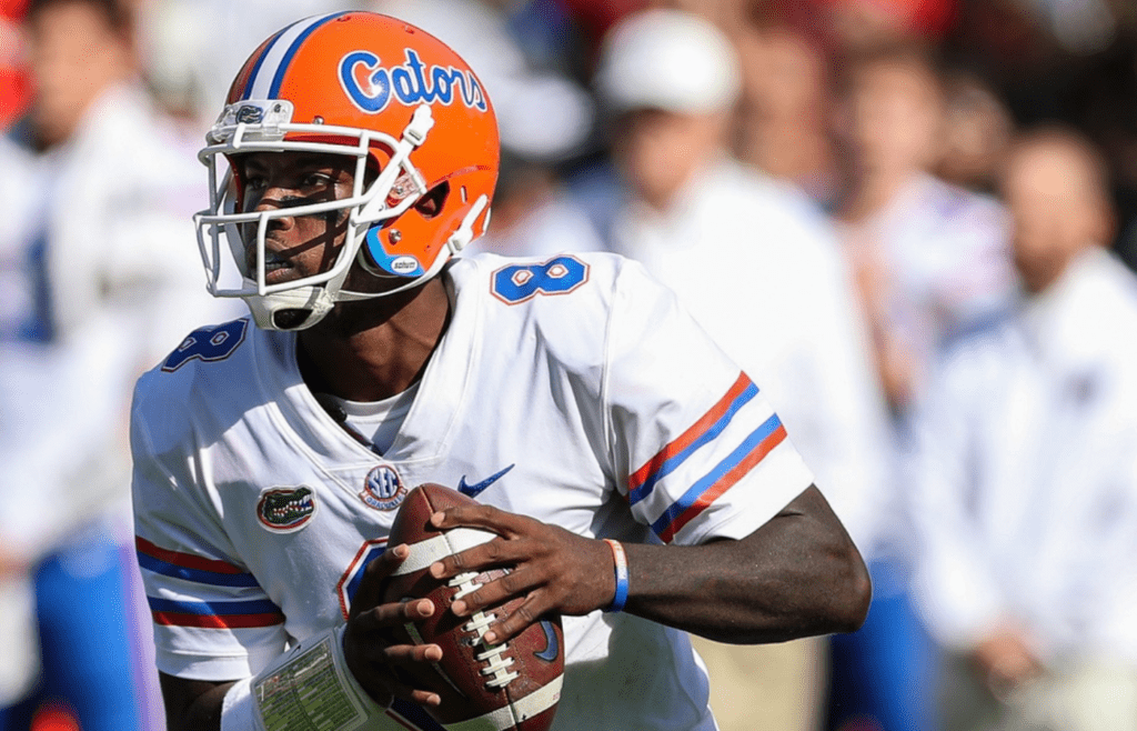 Nov 11, 2017; Columbia, SC, USA; Florida Gators quarterback Malik Zaire (8) rolls out for a pass against the South Carolina Gamecocks during the first quarter at Williams-Brice Stadium. Mandatory Credit: Jim Dedmon-Imagn Images
