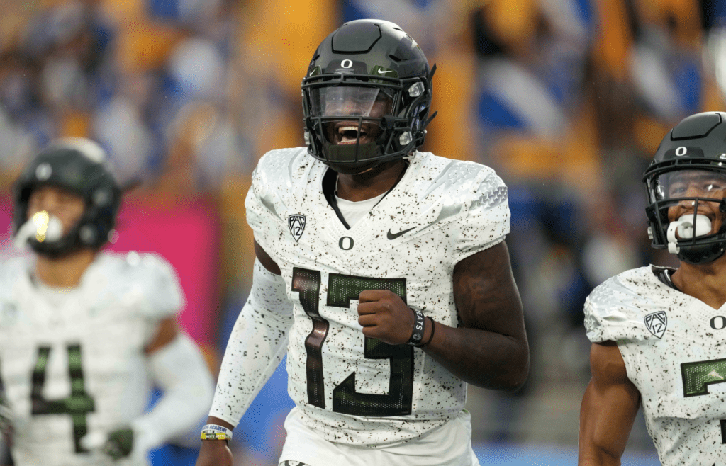 Oct 23, 2021; Pasadena, California, USA; Oregon Ducks quarterback Anthony Brown (13) celebrates after scoring on a 43-yard touchdown run against the UCLA Bruins in the second half at Rose Bowl. Oregon defeated UCLA 34-31. Mandatory Credit: Kirby Lee-Imagn Images