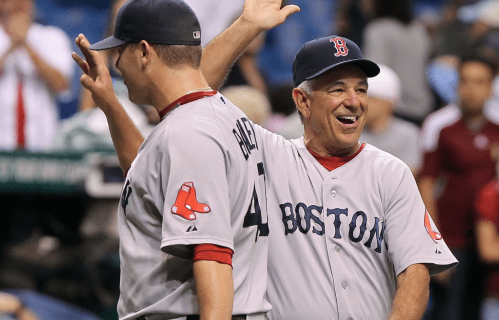 September 18, 2012; St. Petersburg, FL, USA; Boston Red Sox manager Bobby Valentine (25) smiles after he high fives relief pitcher Andrew Bailey (40) after they beat the Tampa Bay Rays at Tropicana Field. Boston Red Sox defeated the Tampa Bay Rays 7-5. Mandatory Credit: Kim Klement-Imagn Images