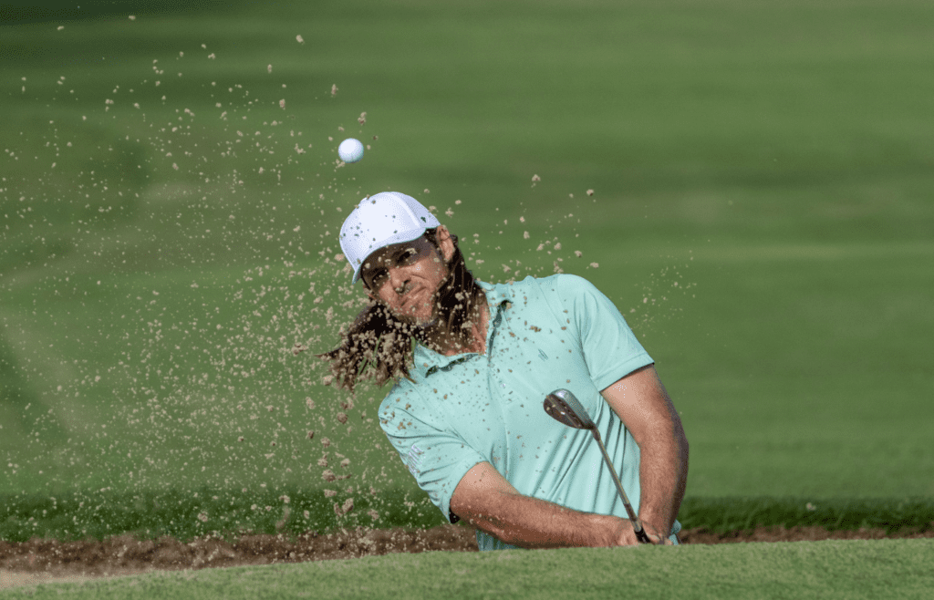 January 10, 2025; Honolulu, Hawaii, USA; Aaron Baddeley hits his bunker shot on the ninth hole during the second round of the Sony Open golf tournament at Waialae Country Club. Mandatory Credit: Kyle Terada-Imagn Images