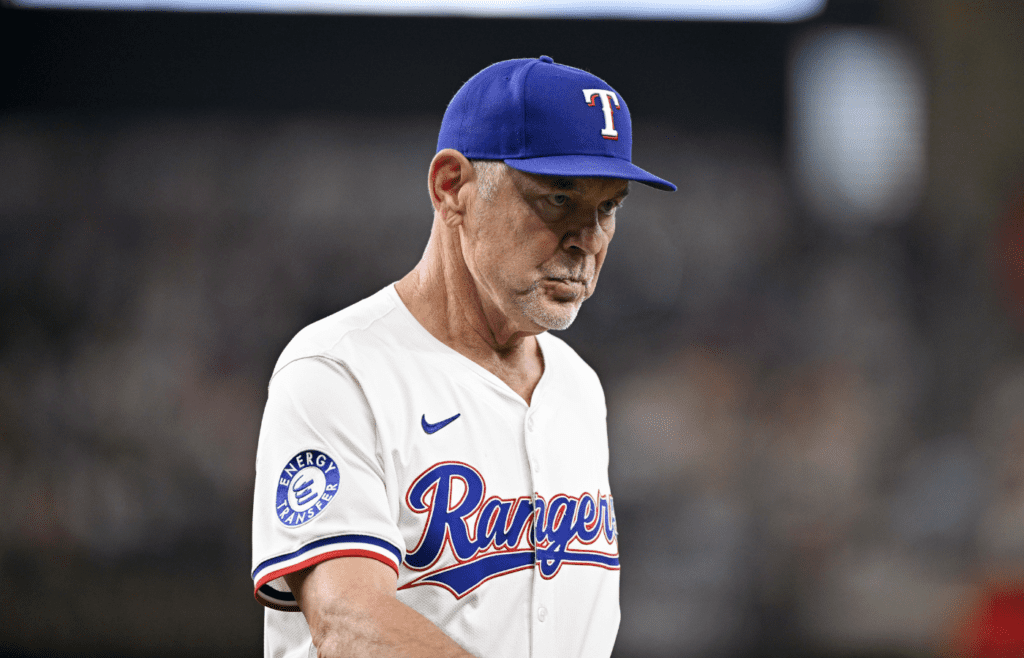 Jun 19, 2025; Arlington, Texas, USA; Texas Rangers manager Bruce Bochy (15) walks back to the dugout during the seventh inning against the Kansas City Royals at Globe Life Field. Mandatory Credit: Jerome Miron-Imagn Images