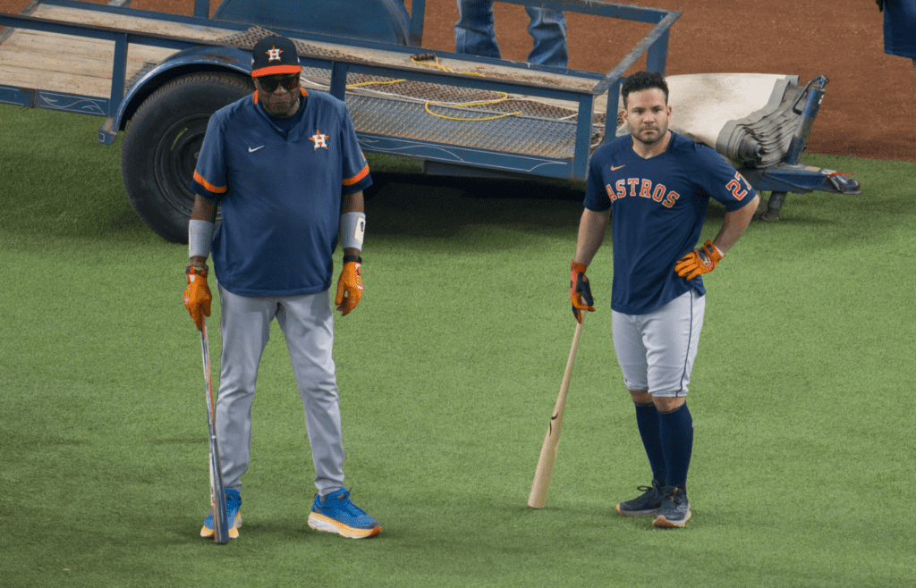 Oct 19, 2023; Arlington, Texas, USA; Houston Astros manager Dusty Baker (12) and second baseman Jose Altuve (27) watch batting practice before the game against the Texas Rangers in game four of the ALCS for the 2023 MLB playoffs at Globe Life Field. Mandatory Credit: Jerome Miron-Imagn Images