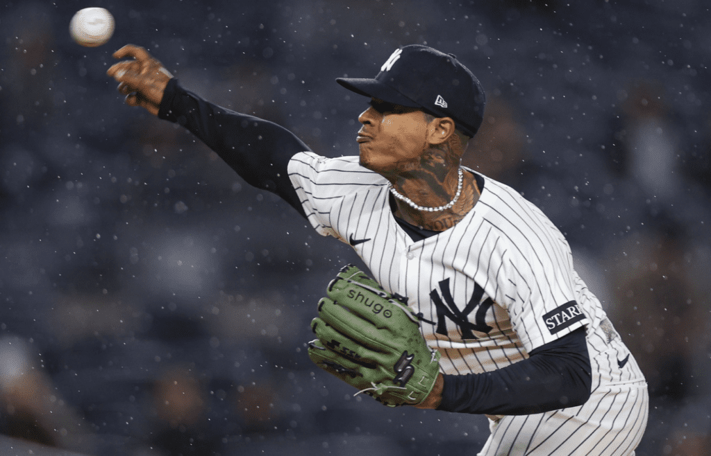 Apr 11, 2025; Bronx, New York, USA; New York Yankees starting pitcher Marcus Stroman (0) delivers a pitch during the first inning against the San Francisco Giants at Yankee Stadium. Mandatory Credit: Vincent Carchietta-Imagn Images