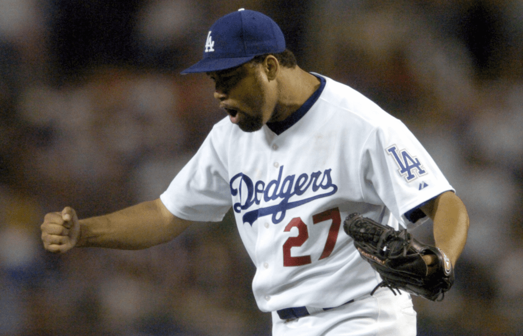 Aug 20, 2004; Los Angeles, CA, USA; Los Angeles Dodgers starter Jose Lima (27) celebrates after a groundout to the end the eighth inning of 3-2 victory over the Atlanta Braves in 11 innings at Dodger Stadium. Mandatory Credit: Kirby Lee/Image of Sport-Imagn Images