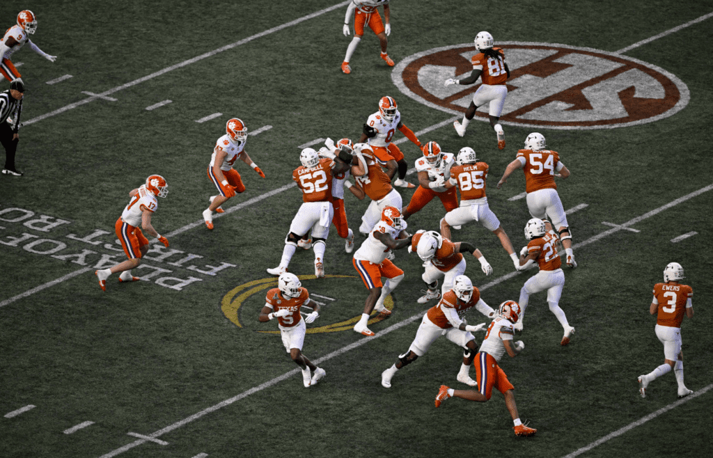 Dec 21, 2024; Austin, Texas, USA; A view of the action in front of the SEC logo during the game between the Texas Longhorns and the Clemson Tigers in the CFP National Playoff First Round at Darrell K Royal-Texas Memorial Stadium. Mandatory Credit: Jerome Miron-Imagn Images