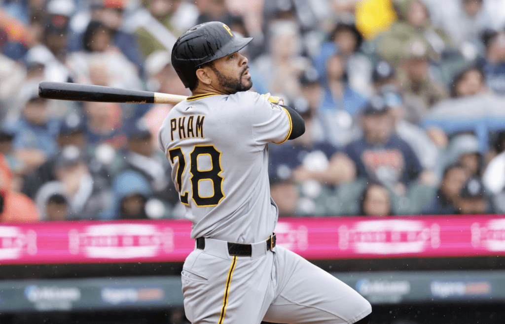 Jun 19, 2025; Detroit, Michigan, USA; Pittsburgh Pirates outfielder Tommy Pham (28) hits a sacrifice fly to score a run in the sixth inning against the Detroit Tigers at Comerica Park. Mandatory Credit: Rick Osentoski-Imagn Images