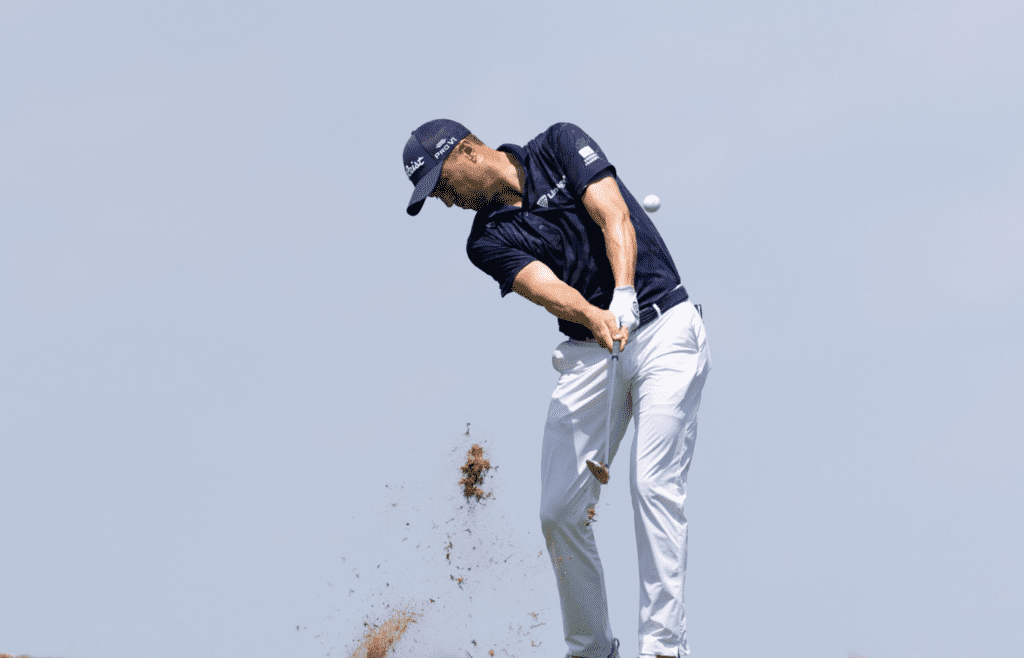 Jun 20, 2025; Cromwell, Connecticut, USA; Justin Thomas plays a shot on the 14th hole during the second round of the Travelers Championship golf tournament. Mandatory Credit: Bill Streicher-Imagn Images