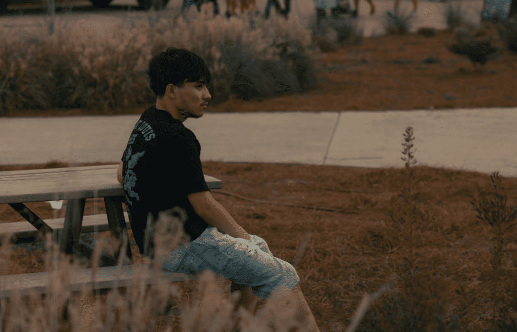 A person sitting alone in a peaceful setting