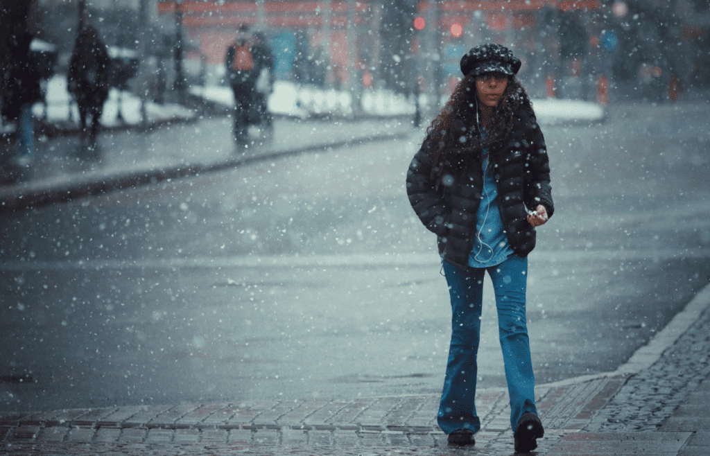 A person stepping into a cold shower