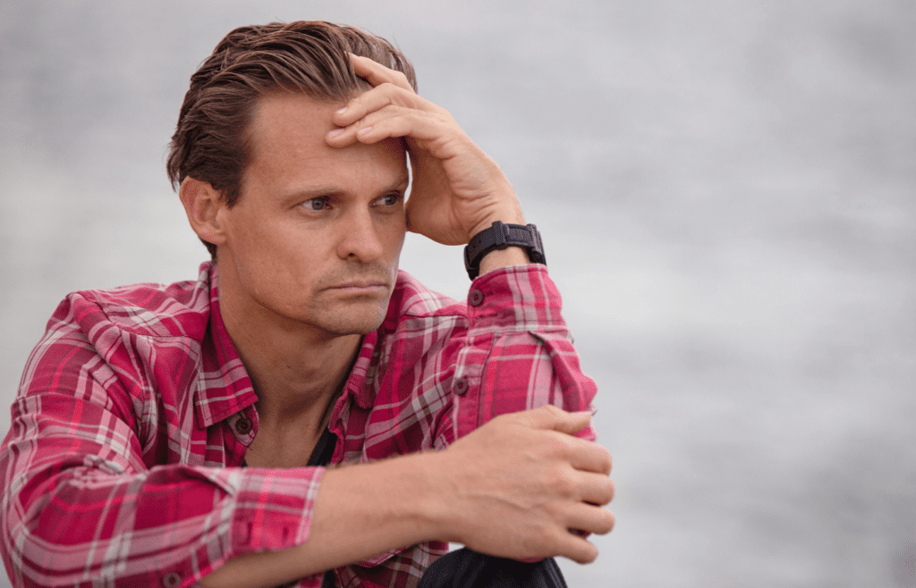 A person looking concerned, deep in thought.