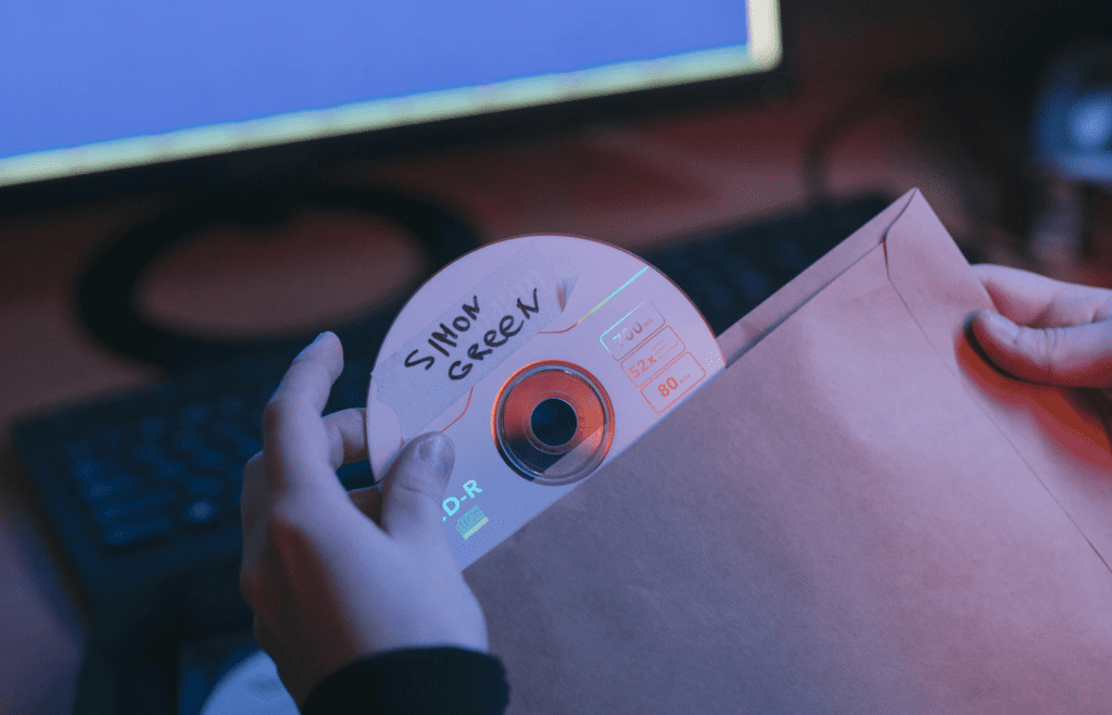 A handwritten tracklist on a jewel case insert